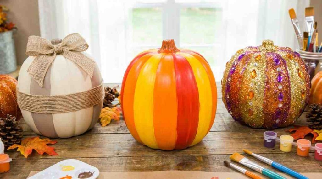 Three DIY painted plastic pumpkins: a colorful basic pumpkin, a neutral farmhouse-style pumpkin with twine, and a sparkling glitter pumpkin, showcasing creative seasonal décor ideas.